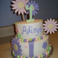 Adisyn's Daisy First Birthday Cake All buttercream with fondant accents and gumpaste daisies.