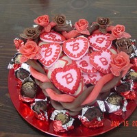 Chocolate Heart 100% Edible Chocolate Heart shaped basket with cut out sugar cookies. Around the bottom are home made oreo and nutter butter truffles....