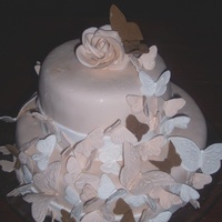 Butterfly Bridal Shower ivory colored white chocolate fondant, gumpaste butterflies & rose(forgive the blemishes--the customer carried the cake inside on a...