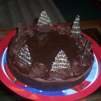 Dark Chocolate Cheesecake dark chocolate cheesecake, dark chocolate ganache (poured & whipped), piped & painted chocolate trees