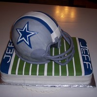 Cowboys Helmet sculpted helmet, all fondant with GP mask. Had issues with the bottom of the helmet wanting to fold and wrinkle, but was able to smooth it...
