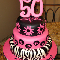 50Th Birthday Zebra And Hot Pink This is a fondant over buttercream birthday cake, w/6-8-10 inch cakes. Gumpaste/fondant number topper.