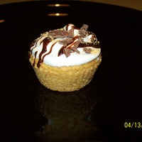 S'mores Cupcakes graham cracker cake with chocolate sauce center, stabilized whipped frosting, a chocolate drizzle & milk chocolate chunk & graham...