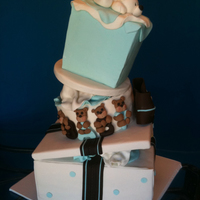 Topsy Turvy Caddy Wampus Blue Brown Baby Shower Originally tried to use the caddy wampus stand but I had to modify it and use wedges between the cakes. I found photos to replicate the...