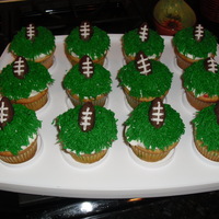 Football Cupcakes Cupcakes made for my sons birthday party. Footballs are candy clay.