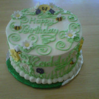 Maddy's Birthday Cake Coconut cake with mango mousse filling and vanilla buttercream frosting with gumpaste flowers and moulded sugar bees.