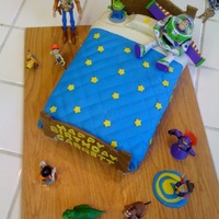 Toy Story Cake I made this b-day cake for one of my 3-yr old twins who loves everything Toy Story! I got the idea of making Andy's bed from some...
