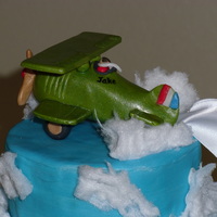 Airplane Baby Shower Cake Moist, from scratch, red velvet cake with cream cheese filling and frosting. Fondant airplane (Curtiss Jenny biplane) towing a banner that...
