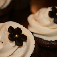 Mocha Chocoyaya's Cupcakes I made to celebrate Mother's Day. They were sinfully delish and a big hit all around! Satin Ice dark chocolate flowers with...