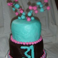 First 2 Tiered Cake! This is the first 2 tiered cake I have done. (I need a lot of practice!) BC icing with fondant balls.