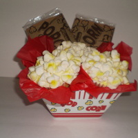 "popcorn" Cupcakes For My Daughter's Band Bake Sale vanilla cupcakes with buttercream frosting, topped with marshmallow 'popcorn' and sprayed with airbrush butter