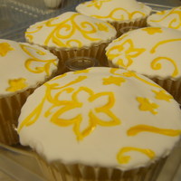 Filled Lemon Lemon cupcake filled with lemon buttercream. Topped with embossed & hand painted fondant.
