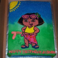 Dora The Explorer 1/2 sheet yellow cake with lemon buttercream icing. Used blue sugar crystals for the "sky".