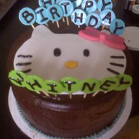 Hello Kitty Birthday Cake Mocha Espresso Cake w/ Espresso Liquor inside layered and frosted with a Chocolate Ganache. Hello Kitty face and Candy Lollies are all...