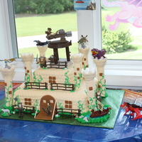 How To Train Your Dragon 11x15 bottom (double layered) - strawberry flavored with an 8 inch square top - orange creamsicle flavored. Cake was made based on the...