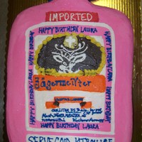 Booze Bottle This cake was cut out of a full sheet cake a favorite drink of a co-worker , shaped and colored to resemble bottle .