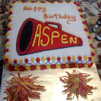Cheerleader Cake I made this for Aspen's 11th Birthday. The pom poms are pieces of cake covered with icing.