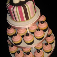 Baby Shower Topper Cake & Cupcakes 6" Topper Cake decorated with stripes and gumpaste shoes. I used my new Cricut Cake (LOVE it!!!) to make the scalloped base under the...