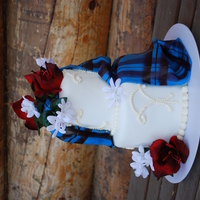 Elliot Tartan Wedding Cake My first go at making a fondant tartan. It's a lot harder than it looks in the tutorial! The flowers are silk...