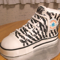 Zebra Print Chuck Taylor This was made for my 12 year old step-daughter's birthday. The zebra print is inlayed MM fondant. The stitching is piped royal icing...