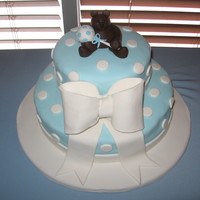Boy Baby Shower Cake This was a baby shower cake for a new baby boy. Everything on the cake is created from fondant including the teddy bear and rattle.