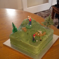 Golf Course Cake Semi rich fruit cake covered in green frosting. The bunkers are made out of demarera sugar, but the people and trees were bought from a...