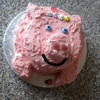Pig Cake Pig cake covered in pink vanilla buttercream.