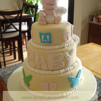 Baby Playing With Blanket Hand molded baby topper playing with blanket.