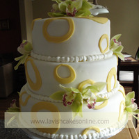 3 Tier Round With Green Orchids And Yellow Circles. 