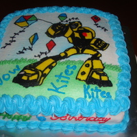 Kite And Transformers Birthday Cake Cake done for a 6 year old boy who like Kites and Transformers so a cake had to be done to incorporate both. All buttercream decoration.