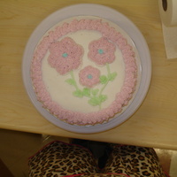 1St Wilton Course 1 Cake Here's the very first cake I made in the Wilton Course 1. All bc. Used cookie cutters for the flowers. It was awesome learning to...