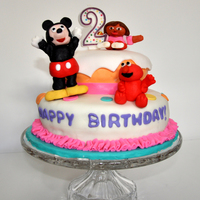 Elmo, Dora And Mickey Fondant Cake My third fondant cake for my daughters 2nd birthday. I couldn't decide on a theme so I went with all the different characters she...
