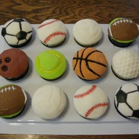 Sports Ball Cupcakes Made for a little boy who was having a sports themed party. Half chocolate and half vanilla WASC with MMF tops.