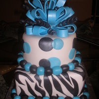Zebra And Teal This cake was made for a 13th birthday celebration. The birthday girl loves teal and zebra print, so the cake was made to incorporate both...