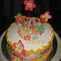Flower Power Buttercream with fondant accents and edible paper. Chocolate cake with fresh strawberries N cream filling.