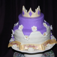 Princess Victoria This was my first 2 tier cake. I made it for my grand daughters first birthday. I used MMF to cover the cake, the flowers and the crown. I...