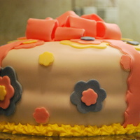 Flower Power Birthday Cake This was my fourth cake ever. This time i decided to try a bow, and it turned out really cute!