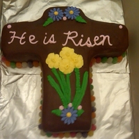 Chocolate Cross Chocolate cake with out a cross pan. Royal icing flowers, surrounded by gumdrops.