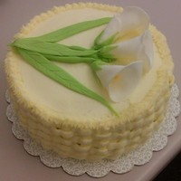 Calla Lillies Hummingbird cake with calla lillies and butter/cream cheese frosting in basketweave.