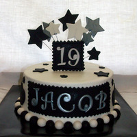 Black & White Yellow cake, Nutella BC, covered in BC. All decorations made from MMF & Satin Ice.