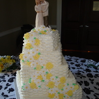 Daisies Wedding Cake 5 tier square cake with handmade white and yellow gum paste daisies