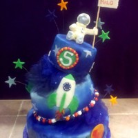 Space Cake 3 tier topsy turvey space themed cake. Every tier was a different flavor. Bottom tier I designed with all the planets, second tier has 3...