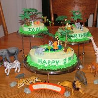 Jungle Cake jungle cake with whipped icing, figurines and royal icing monkeys