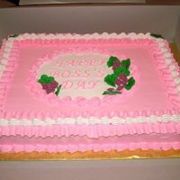 Boss's Day whipped icing with royal violets and leaves.