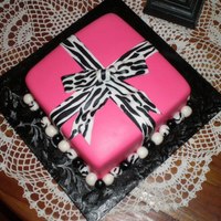 Hot Pink With Zebra Print Bow Gift Box This was made for a 14-year-old girl's birthday. Her mother said she was too old for a purse cake. It wasn't my place to tell her...