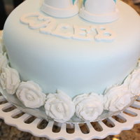 Blue Cake With Fondant Shoes And White Roses My finale cake for class. Using tip #12 and#104. The Wilton Rose. First Fondant Shoes. 8" round 2 Layer cake. Marble Cake and...