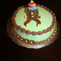 Wilton Course 1 Clown Cake Our second cake from class. Using tip #21, #2D and #3. Figure piping. Shell border. Drop Flower.8" round Yellow Cake filled with...