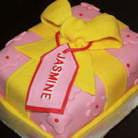 Yellow And Pink Gift Box My second fondant cake. First rectangular shape. First giftbox. First fondant bow. First gift tag. First one I made as a gift. Chocolate...