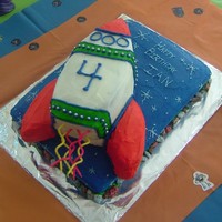 Rocket Ship Cake 2- 9x13 cakes, one pieced together as the rocket and frosted with buttercream.