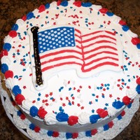 Memorial Day Cake chocolate fudge chocolate chip cake with cookies and cream mousse filling and whipped cream icing, topped with an fbct flag